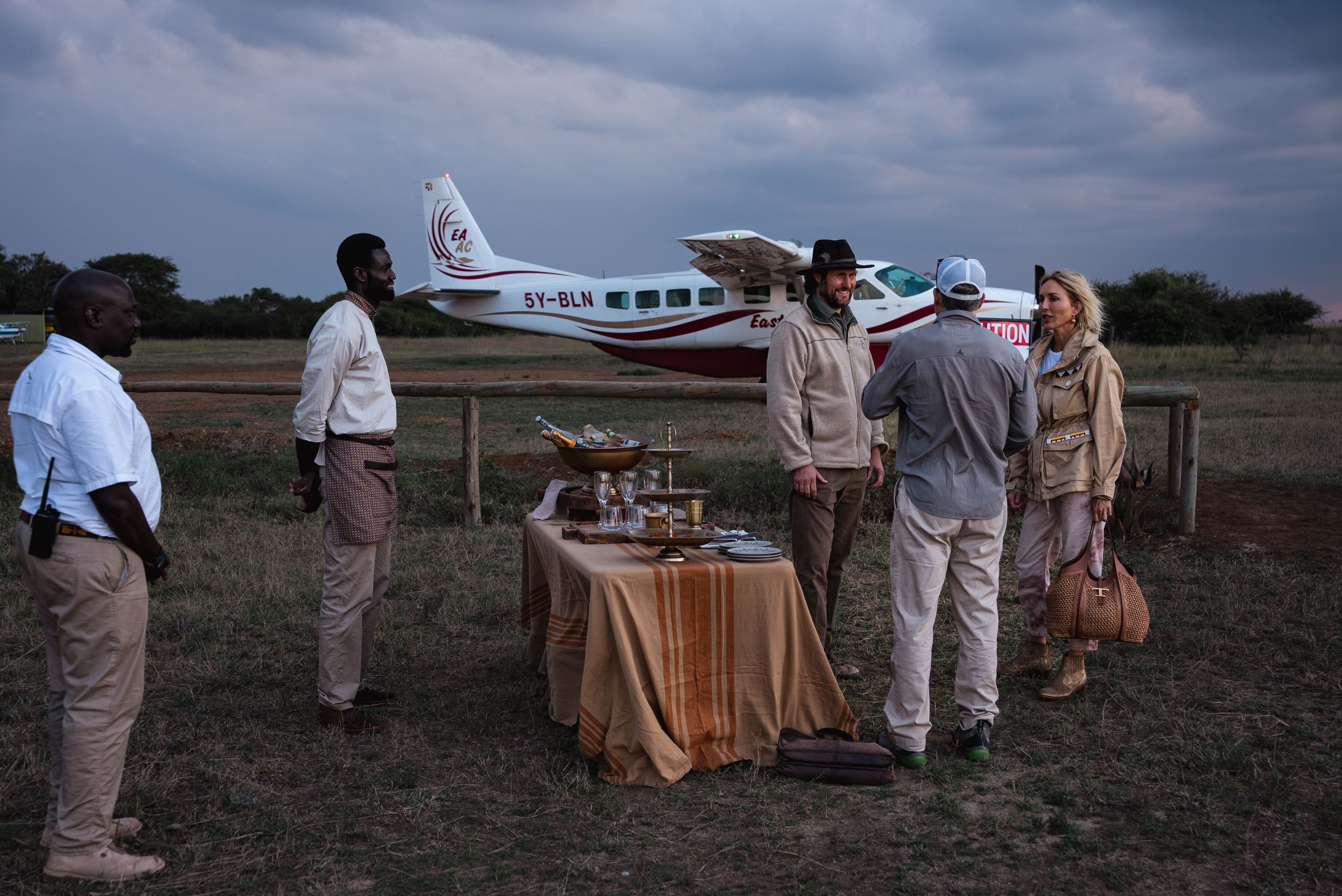 Guests arriving at the Suyian airstrip at dusk